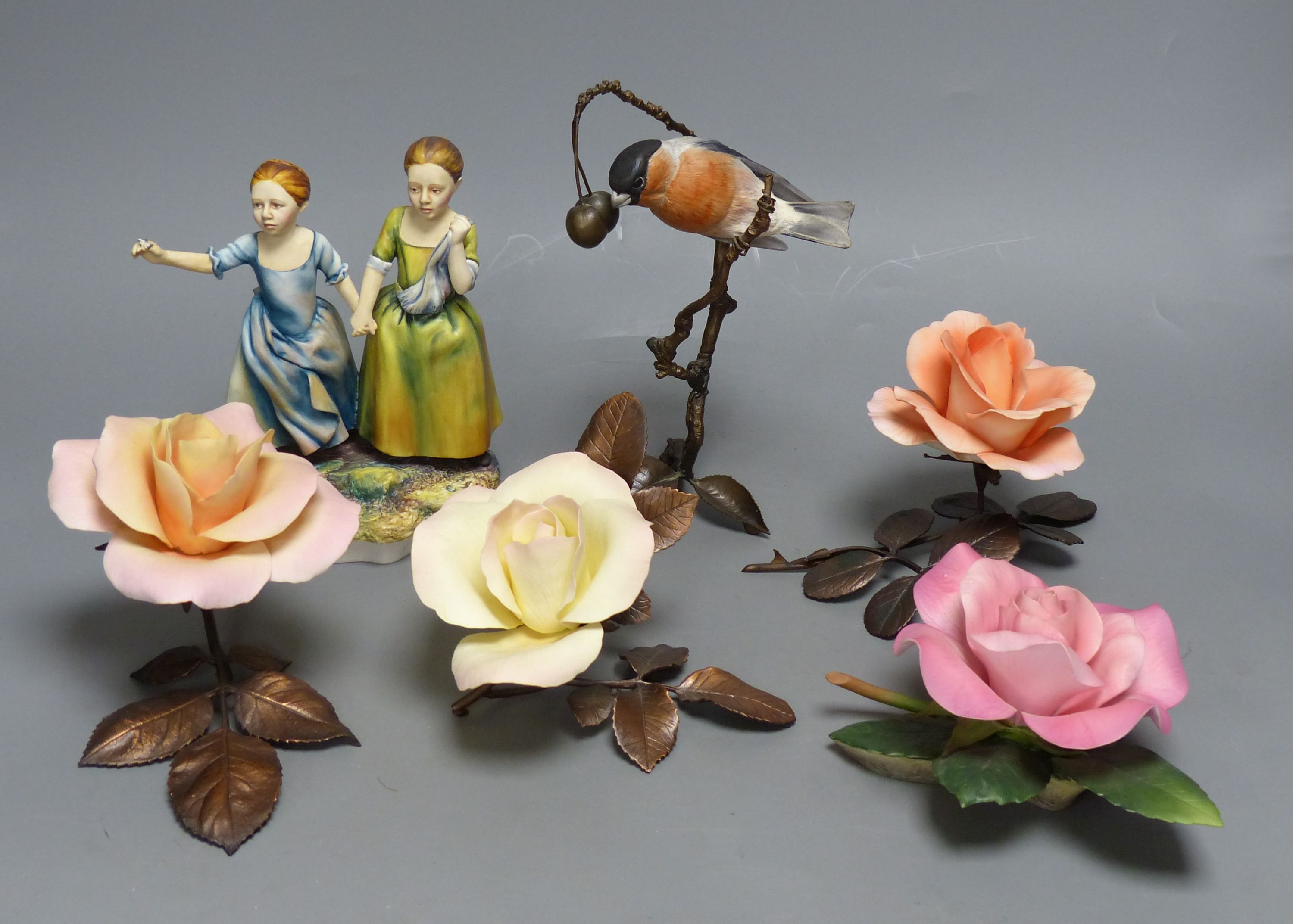 Four Boehm porcelain and bronzed metal roses, a similar model of a bullfinch eating berries and a Hereford Fine China group of two girls